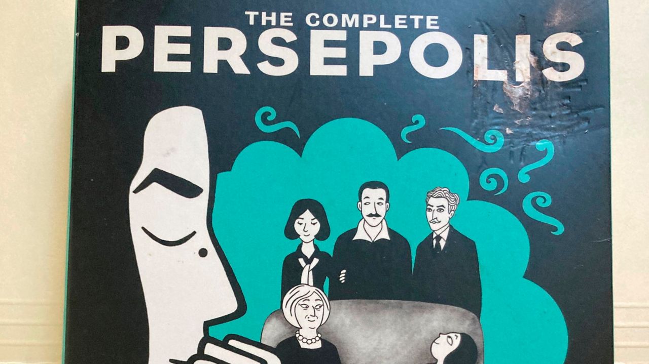Commack schools educator plans lawsuit, says he was
reassigned for 'outspokenness' over book 1