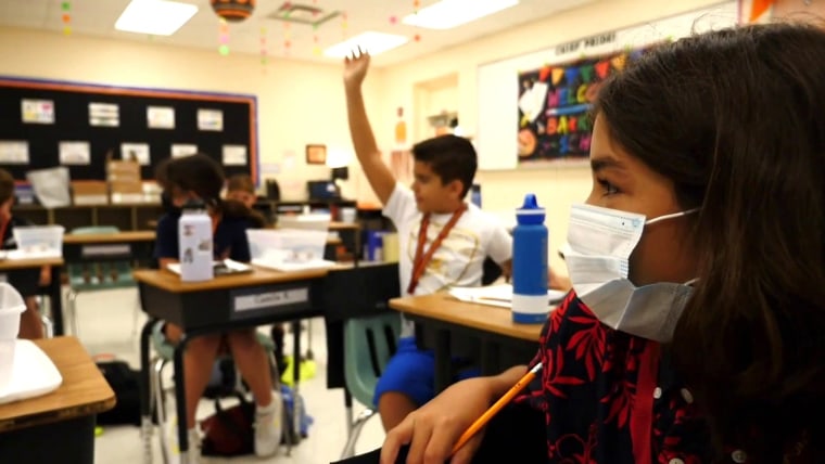 Texas' largest school district defies governor, approves
mask mandate for students 1