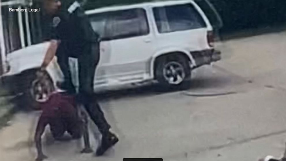 California officer shoots at suspect but kills
bystander 1