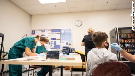As Georgia school district bucks CDC mask guidance, parents
take their kids out of school 1