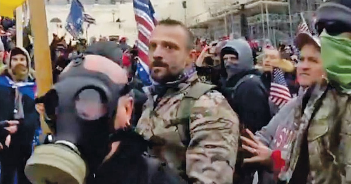 Capitol riot suspect charged with assault after allegedly
throwing photographer over wall 1