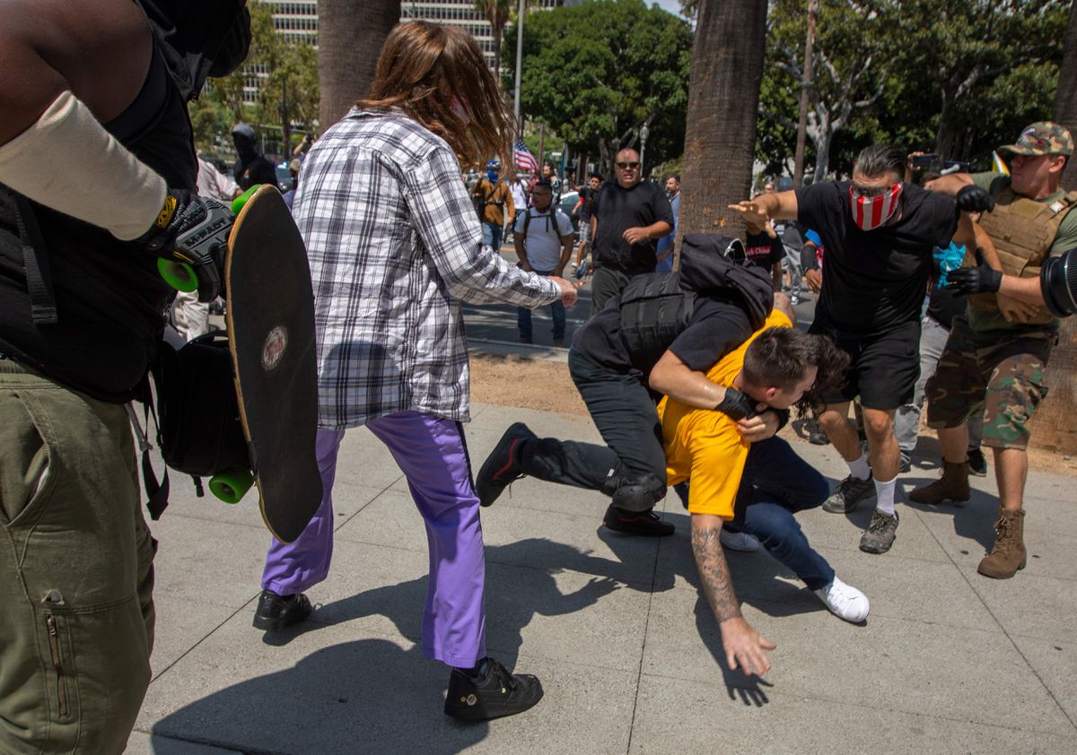 Man stabbed, reporter attacked at L.A. anti-vax
protest 1 Man stabbed, reporter attacked at L.A. anti-vax
protest 1