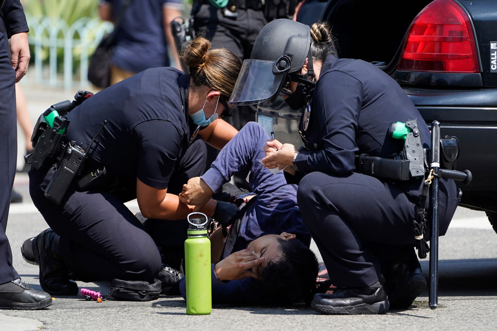 LA man stabbed during dueling COVID vaccine mandate
protests 1