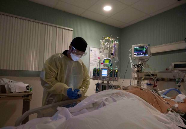 California COVID-19 hospitalizations, cases top 2020 summer
surge 1