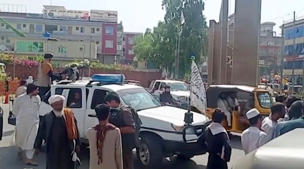 Several killed in flag-waving protests as Taliban celebrate
Afghan independence 1