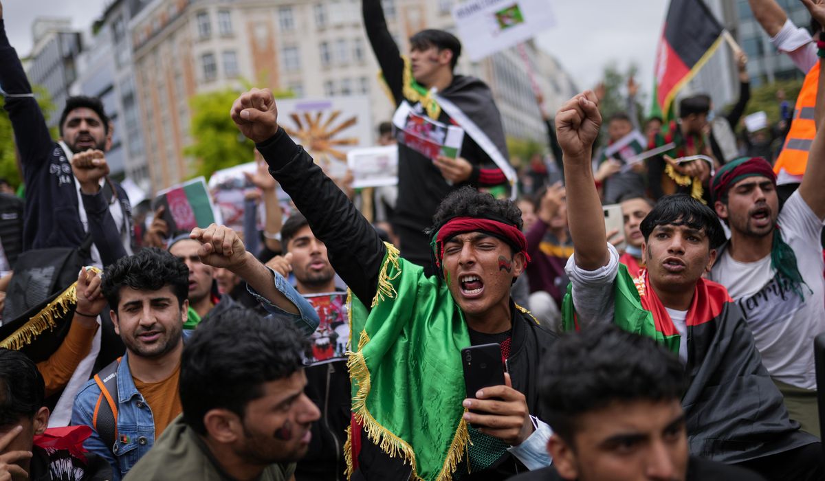 Taliban fighters clash with protesters in first major
violence since fall of Kabul 1