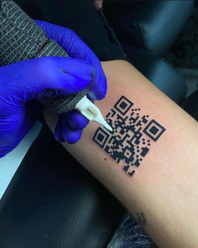 Inked up: Man gets tattoo of COVID-19 vaccine QR code on his
arm 1