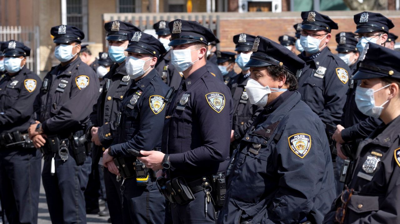 Unvaccinated NYPD cops must wear masks, department memo
says 1