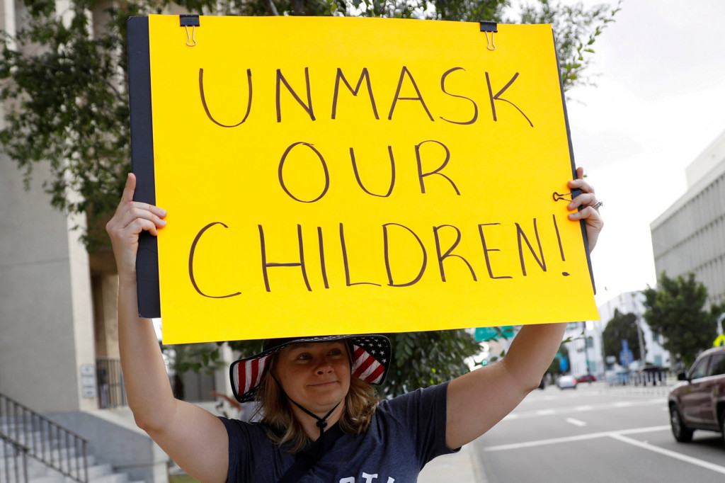 Teacher placed on administrative leave for comparing
anti-maskers to KKK 1