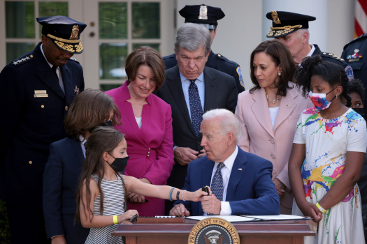Biden signs bill awarding Congressional medal to police
officers 1
