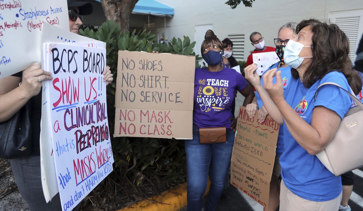 Schools fight back against GOP governors, defy bans on
masks 1