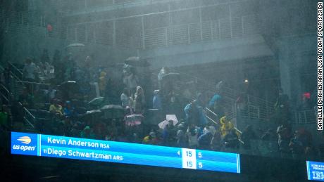 US Open match suspended as rain poured through stadium
roof 1