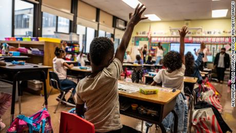 Schools don't need to see a big uptick in Covid-19 cases if
they follow these measures, Fauci says 1