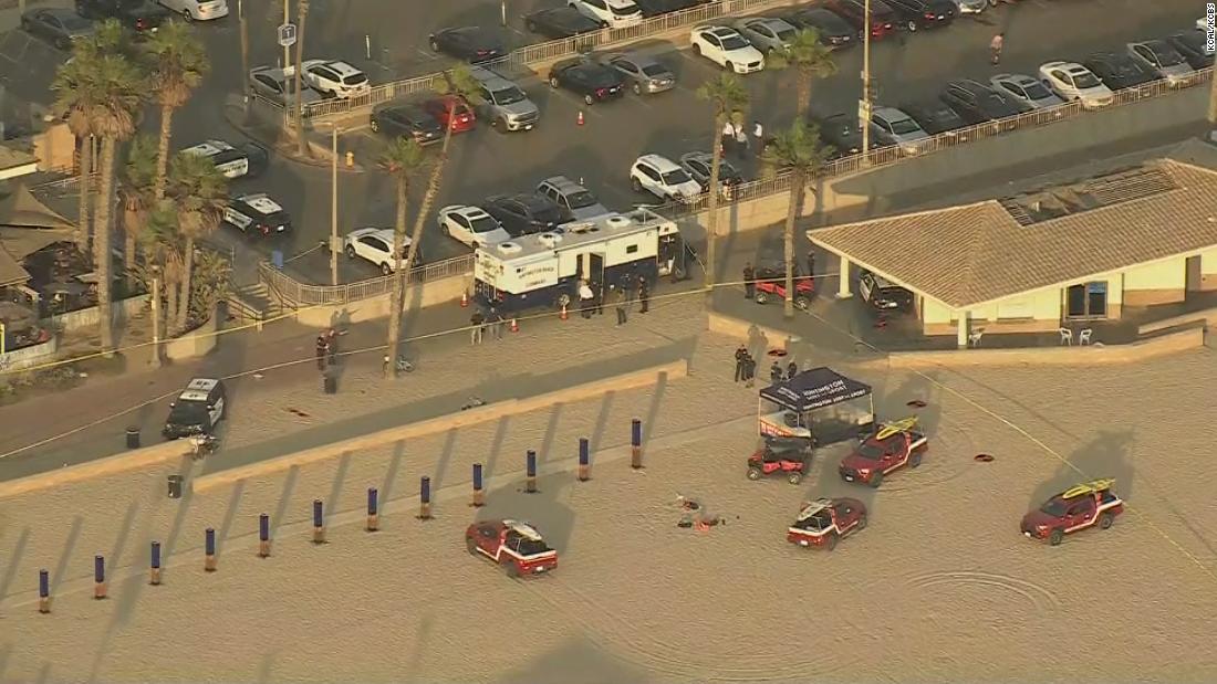 Police say they shot and killed an armed man near where
crowds had gathered for the US Open of Surfing event 1