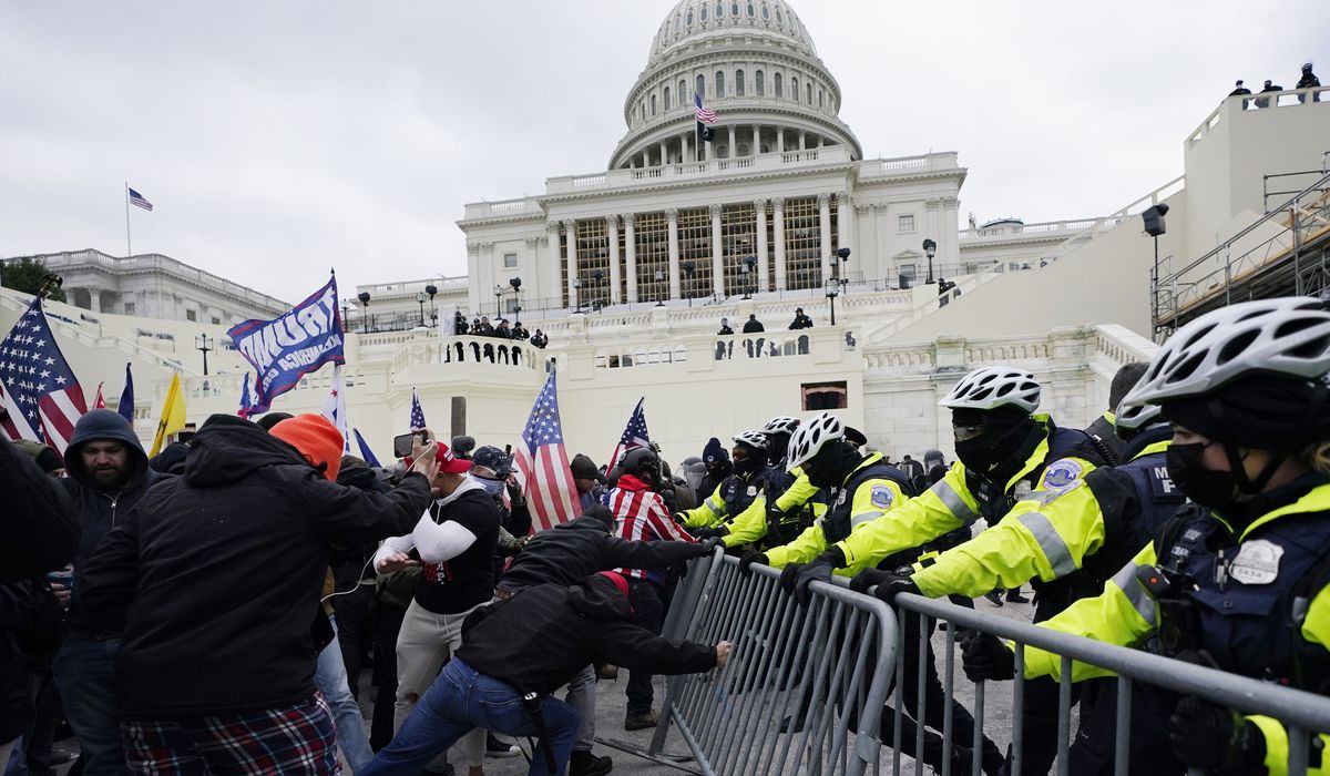 Poll shows dramatic partisan differences in how Americans
view Jan. 6 riot at the U.S. Capitol 1