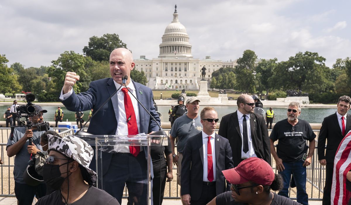 Man with gun arrested at 'Justice for J6' rally is a federal
law enforcement officer: Reports 1