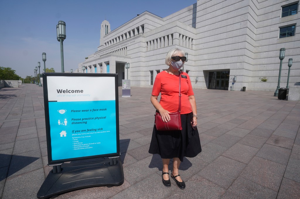 Mormon church to require masks in temples amid COVID
surge 1