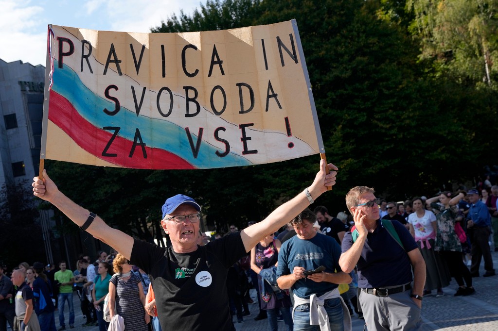 Slovenia police use water cannons at anti-COVID pass
protest 1