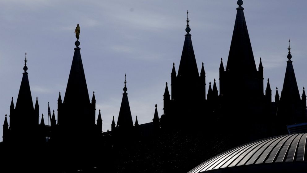 Mormon church to require masks in temples amid COVID
surge 1