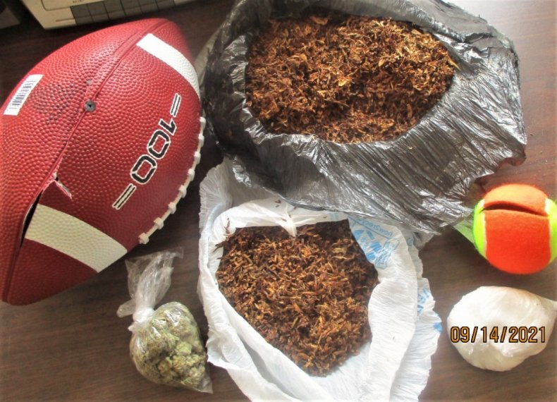 Officers Intercept Football Packed with Marijuana, Crystal
Meth Outside Prison Yard 1