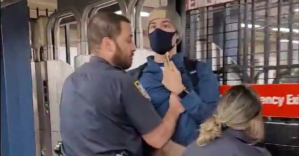 Unmasked Police Officers Remove a Subway Rider After He
Confronts Them 1