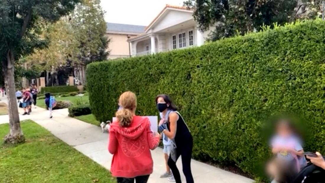 Anti-vax protesters at school event: This is rape 1 Anti-vax protesters at school event: This is rape 1