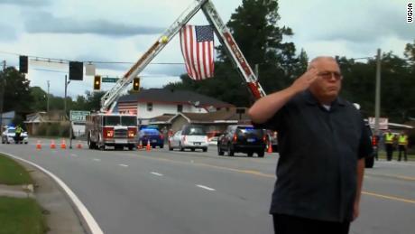 Officer killed considered career change but decided, 'I love
what I'm doing,' his father said 1