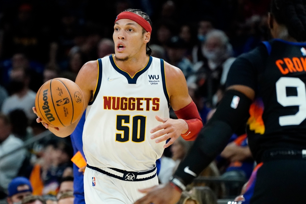 Nuggets swat Suns to seize resounding opening-night
victory 1