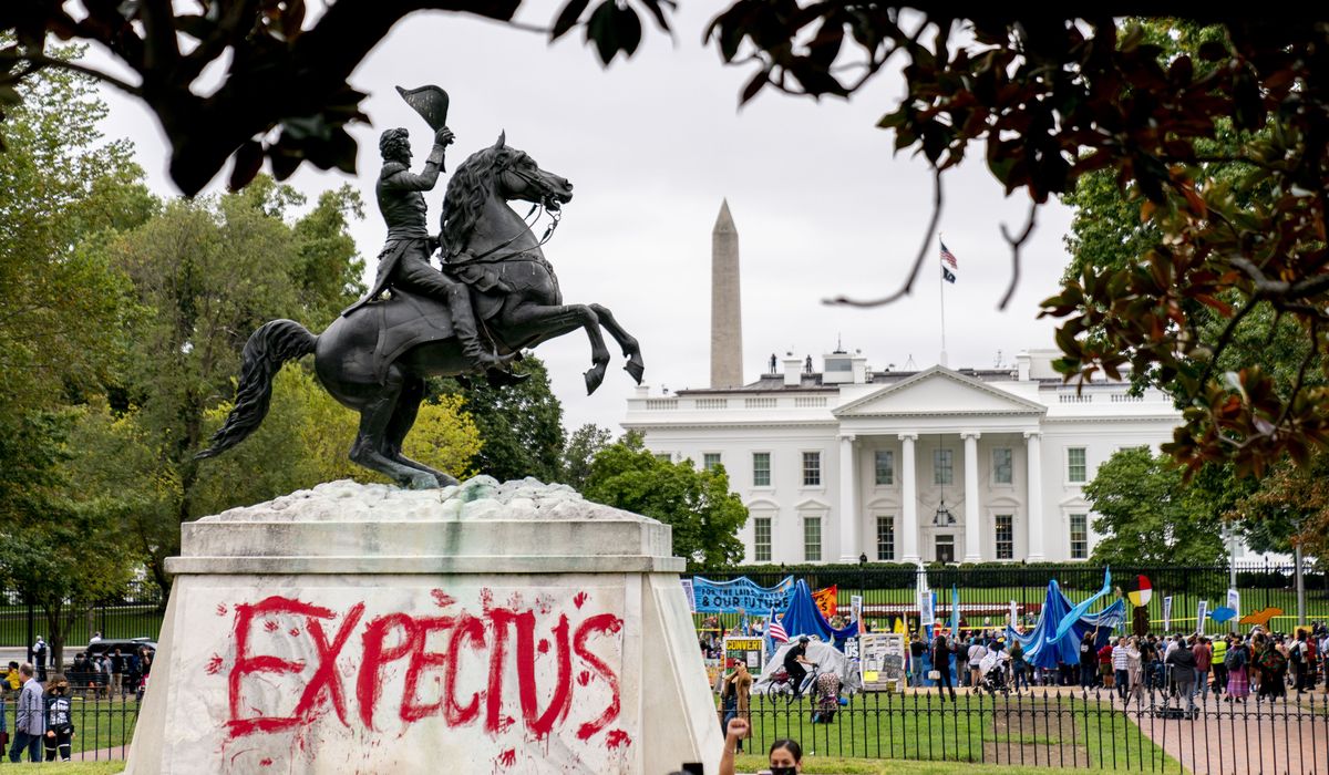 Climate protesters demand 'respect' from Biden, vandalize
Andrew Jackson statue 1