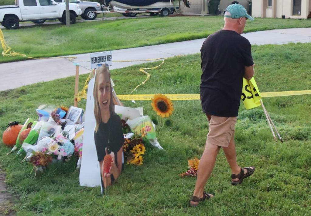Brian Laundrie’s dad emerges to rip down protest sign from
front yard 1