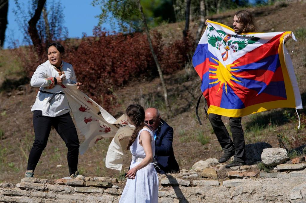 Protestors disrupt flame lighting for Beijing Winter
Games 1