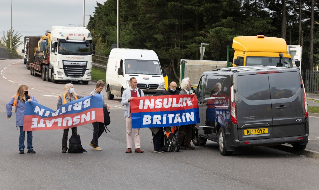 Mom in UK drives her SUV into climate protesters blocking
road 1