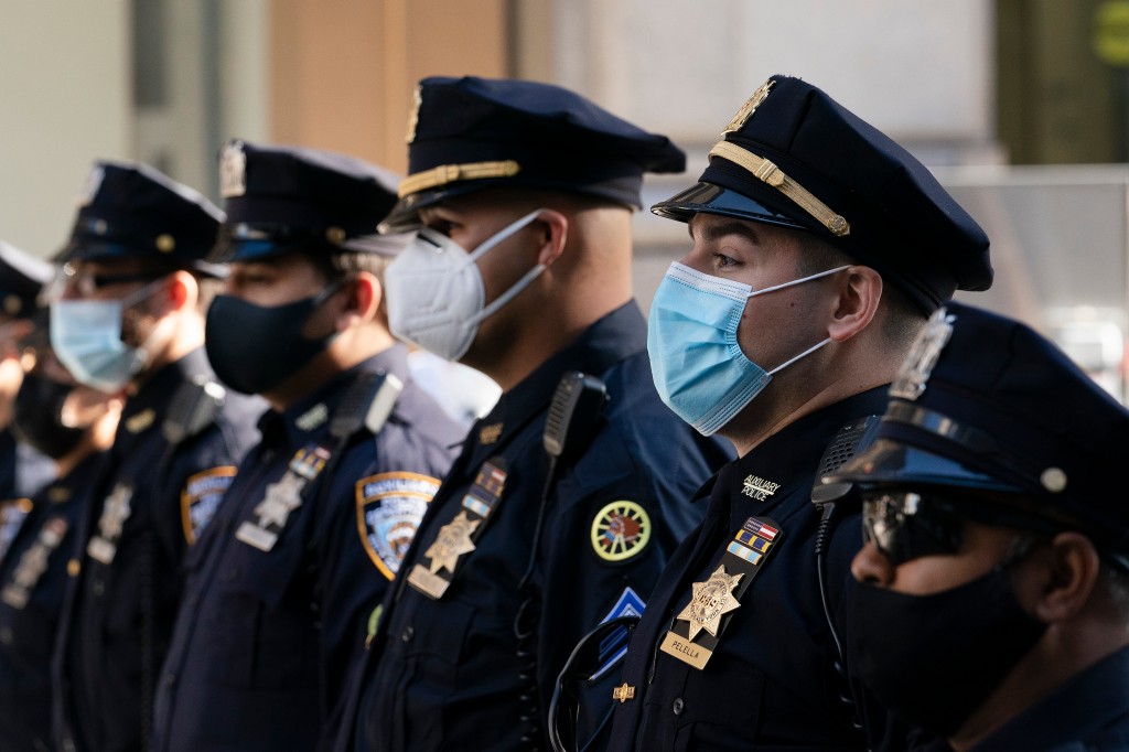 Hundreds of NYPD cops get COVID-19 shot as vaccine deadline
looms 1