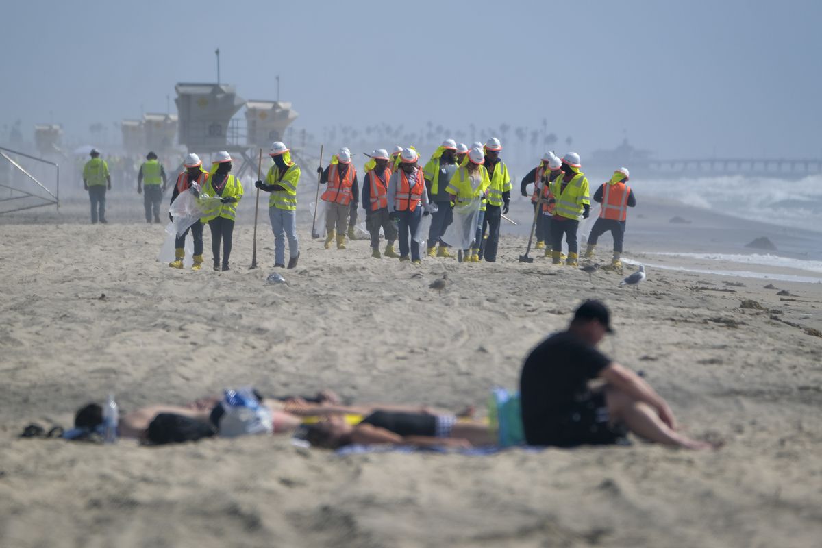 Huntington Beach shore reopens to swimmers for the first
time since oil spill 1