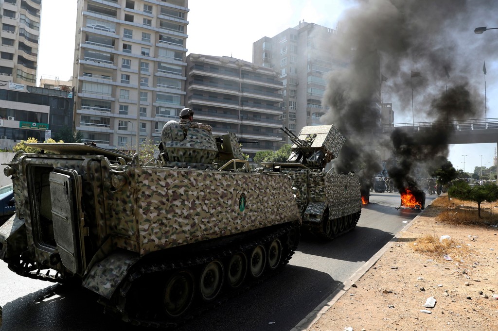 Six dead, dozens injured as Beirut protest erupts into heavy
gunfights 1