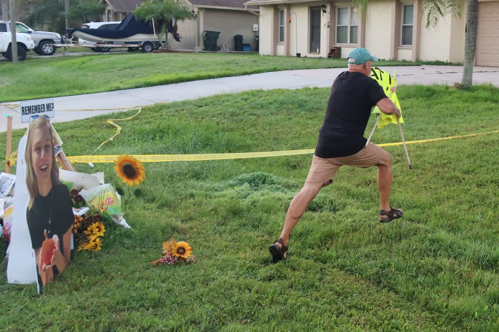 Brian Laundrie’s dad hit with summons for trashing protester
sign 1