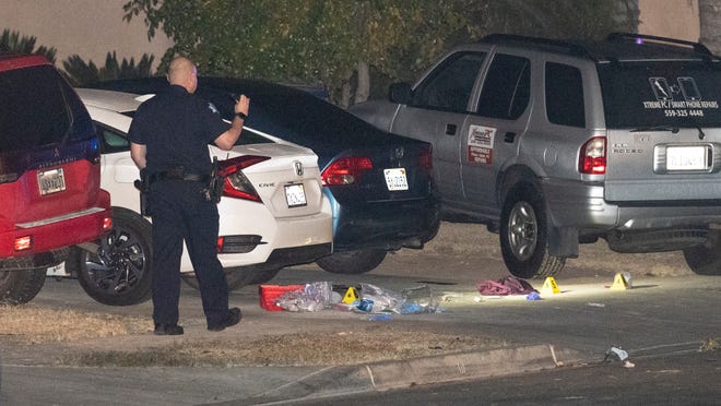 Man fatally shot after stabbing police officer in throat,
beating son to death with a rock 1