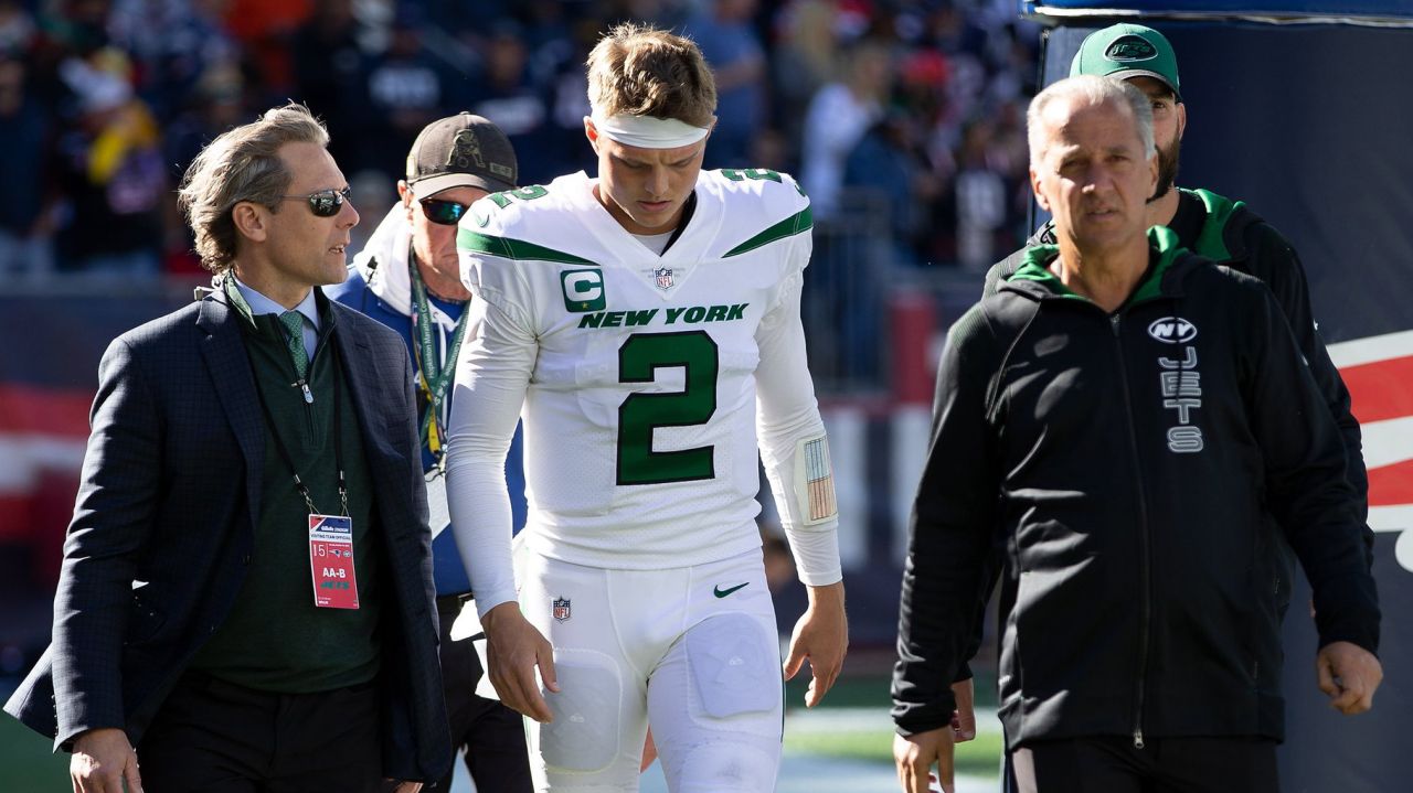 Insult and injury: Jets hammered by Patriots, 54-13, and
Zach Wilson hurts knee 1