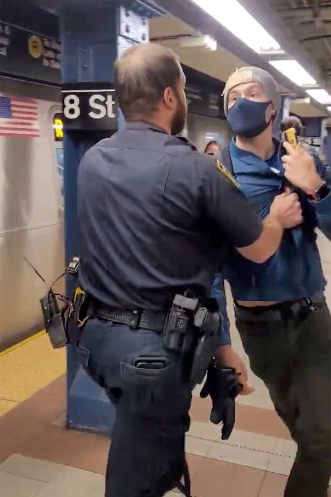 Cops push straphanger out of NYC subway station after he
asks them to mask up 1
