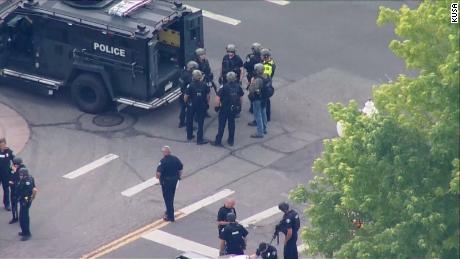 Colorado officer not charged for fatally shooting 'heroic'
man who killed gunman 1