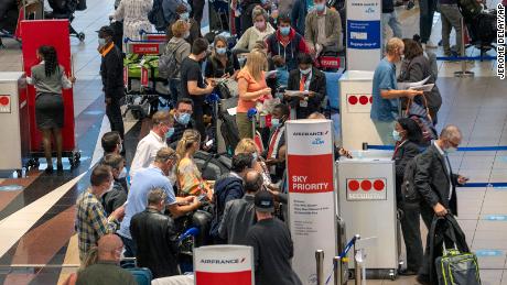 The Omicron Covid-19 variant is raising concerns amid the
holiday travel season, but there's no need to panic just yet,
experts say 1