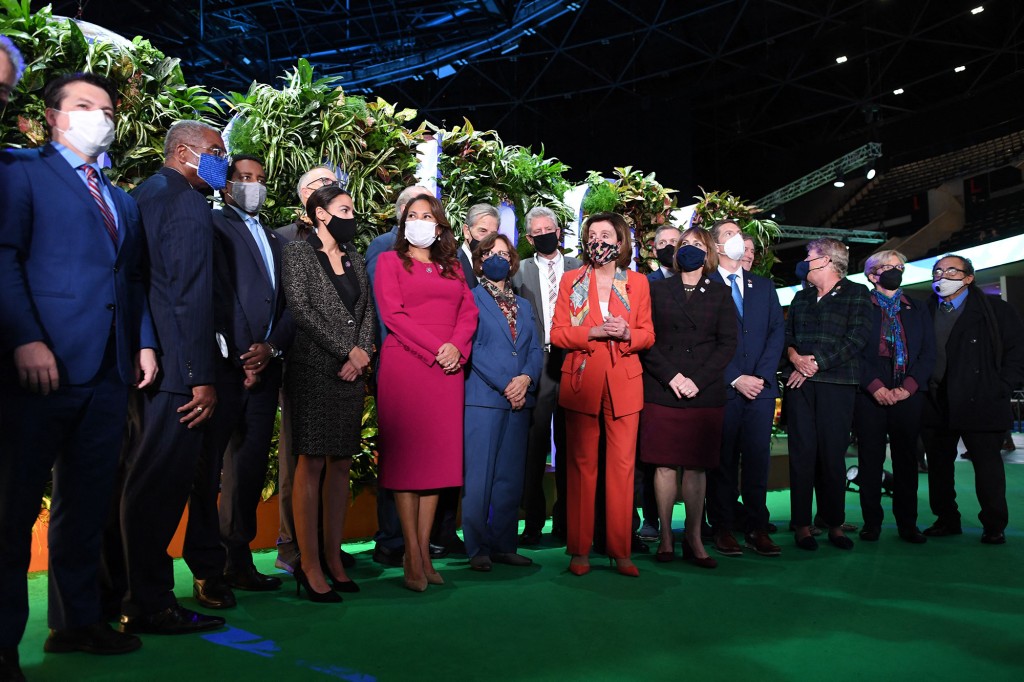 House Dems flout climate change summit rules with maskless
photo op 1