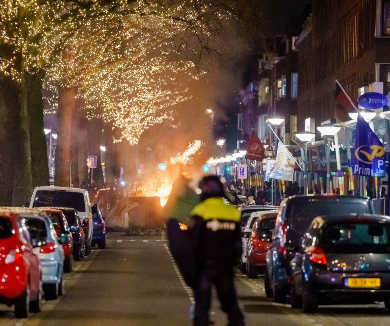 Protests Against COVID Restrictions Erupt in Netherlands,
Police Car Set on Fire 1