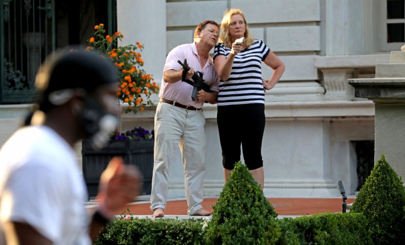 Couple Who Waved Guns at Protesters Lobby to Keep Law
Licenses, Say They Held Off Mob 1