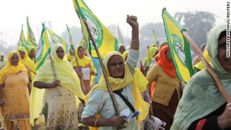 India formally repeals controversial farm laws after year of
protests 1