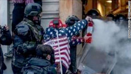 Man who threw fire extinguisher gets longest sentence handed
out for a Capitol rioter so far 1