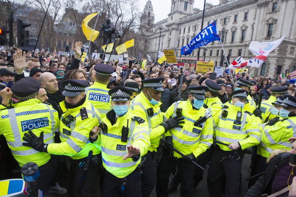 London anti-vax protest leaves police officers hurt:
Reports 1