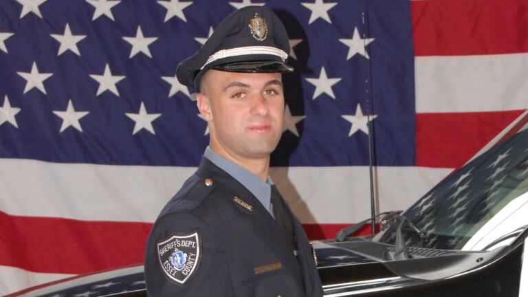 Saugus correctional officer who died from Covid-19 mourned
at candlelight vigil 1