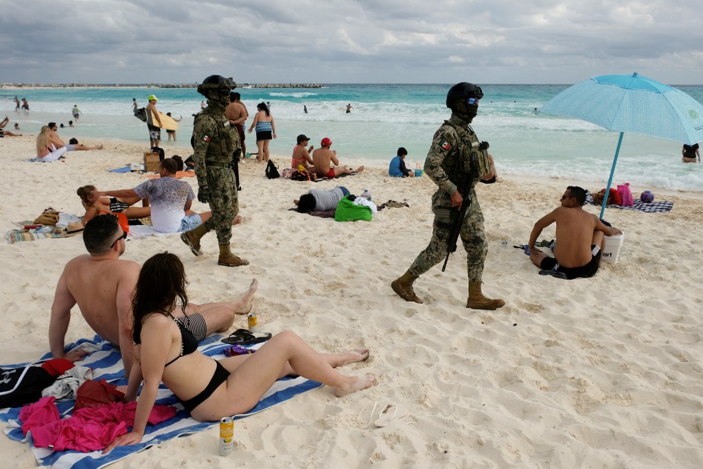 Mexico to bolster security in Cancun after jet ski gunmen
opened fire on beach 1