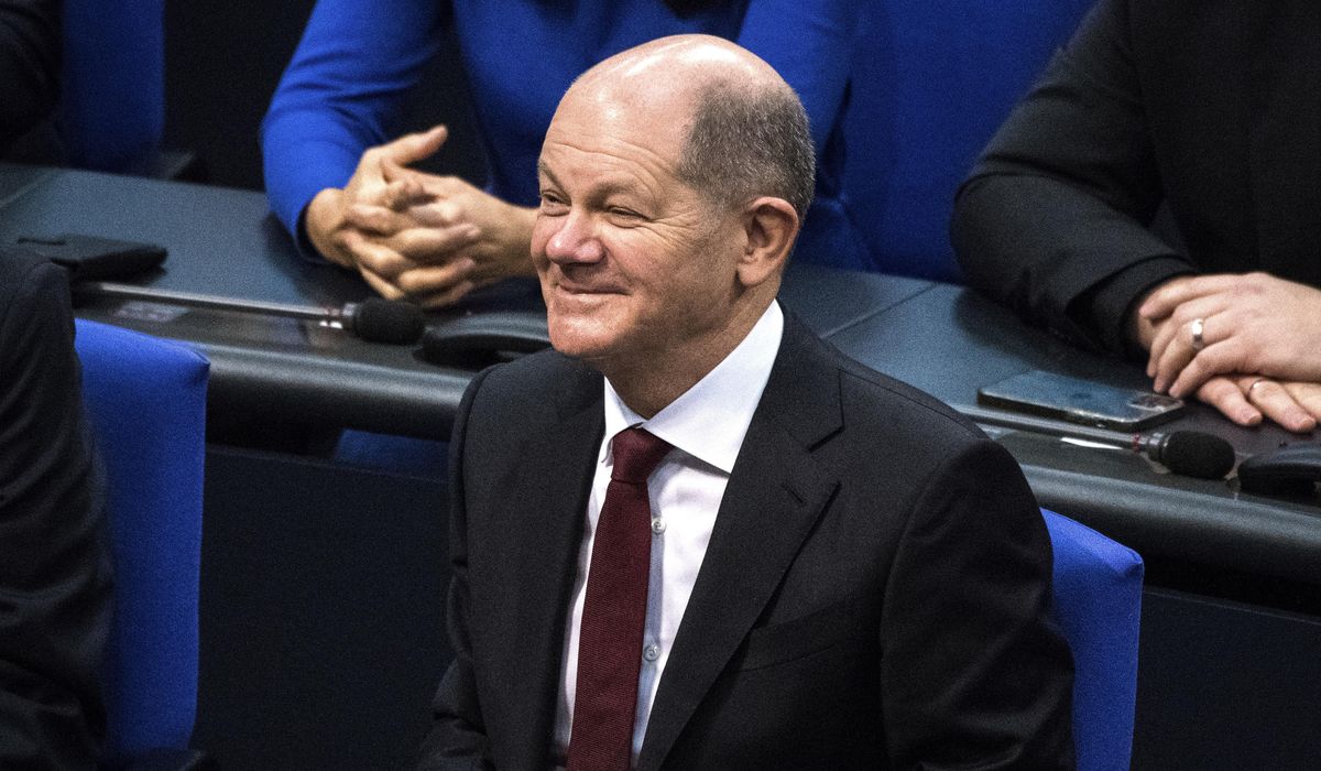 Olaf Scholz succeeds Angela Merkel as German chancellor,
opening new era 1